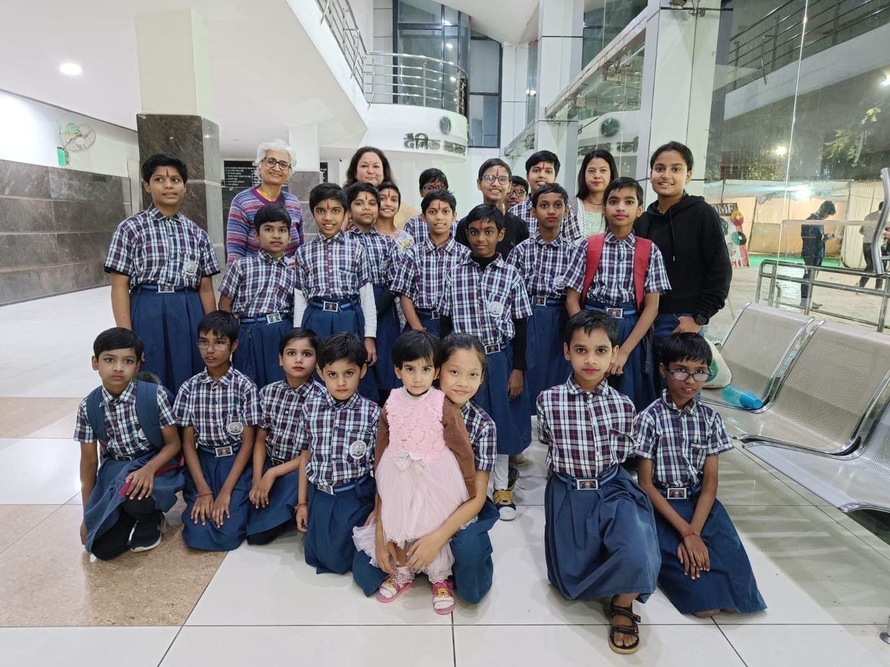 Children in school uniform with founder Sumitra Mishra