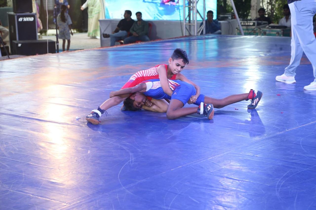 Two wrestlers in action during a kushti match