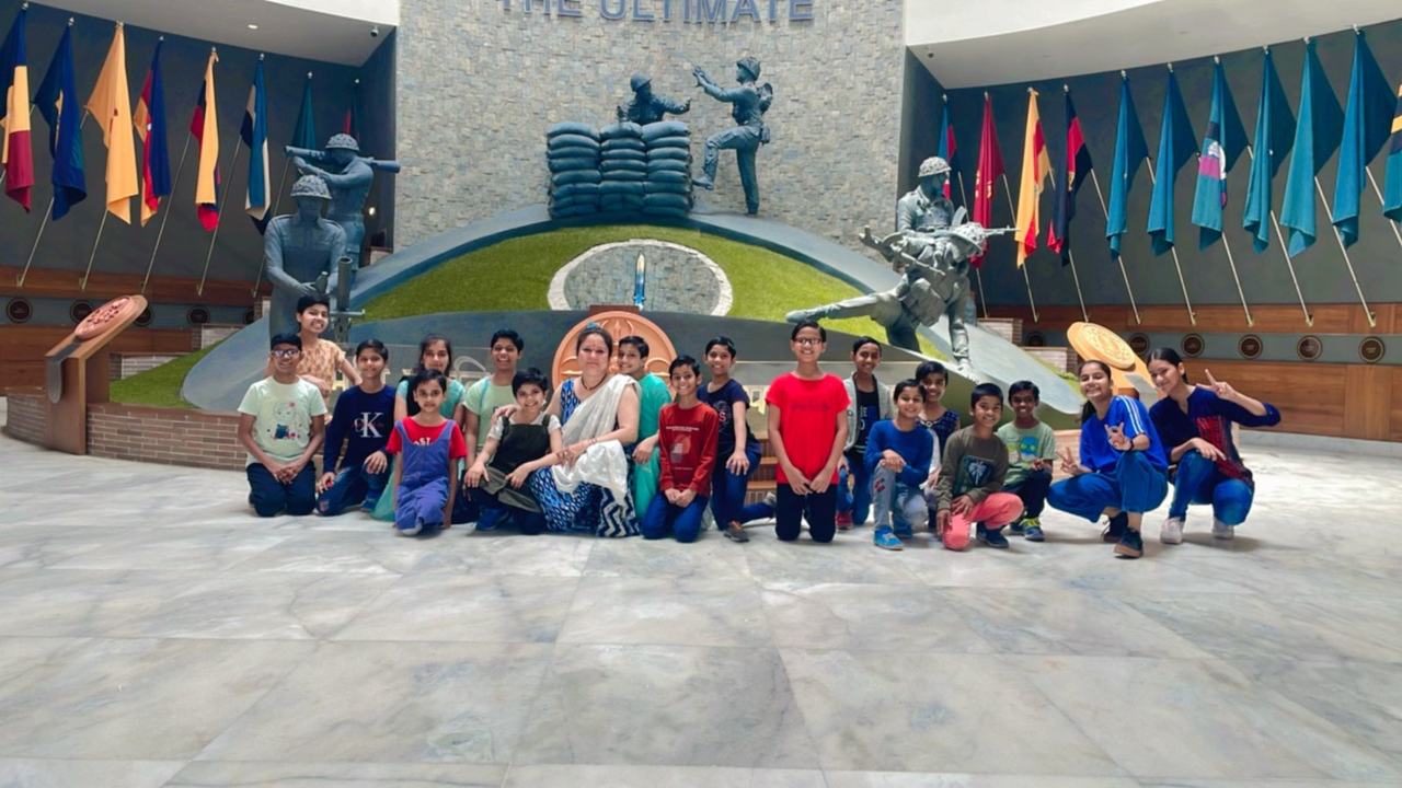 Group photo at a museum with flag displays