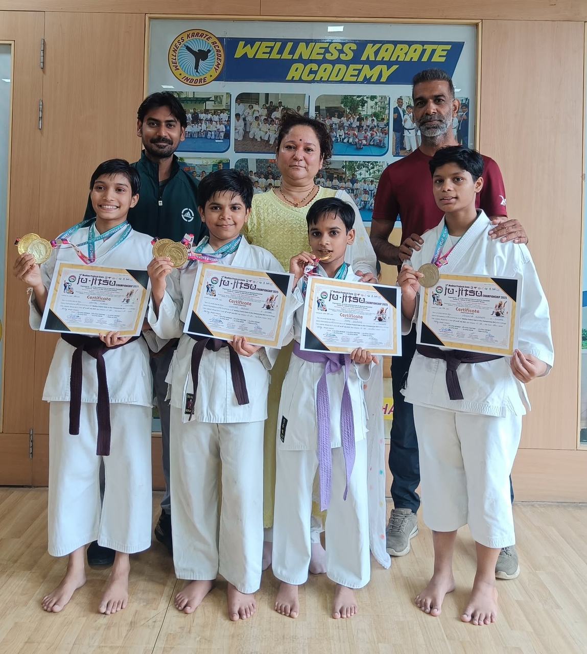 Karate students with their certificates at Wellness Karate Academy