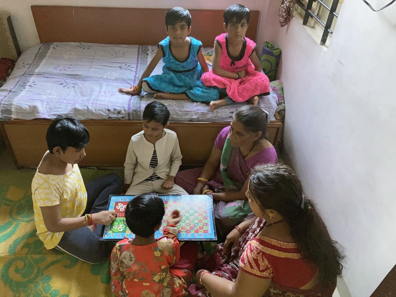 Children learning together on a tablet