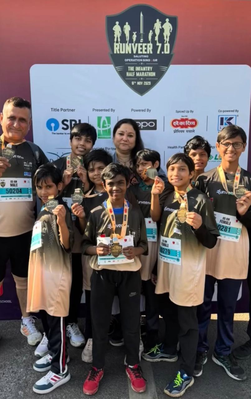Shiv Karmsthali's runners with their medals at the Runveer 7.0 Infantry Half Marathon