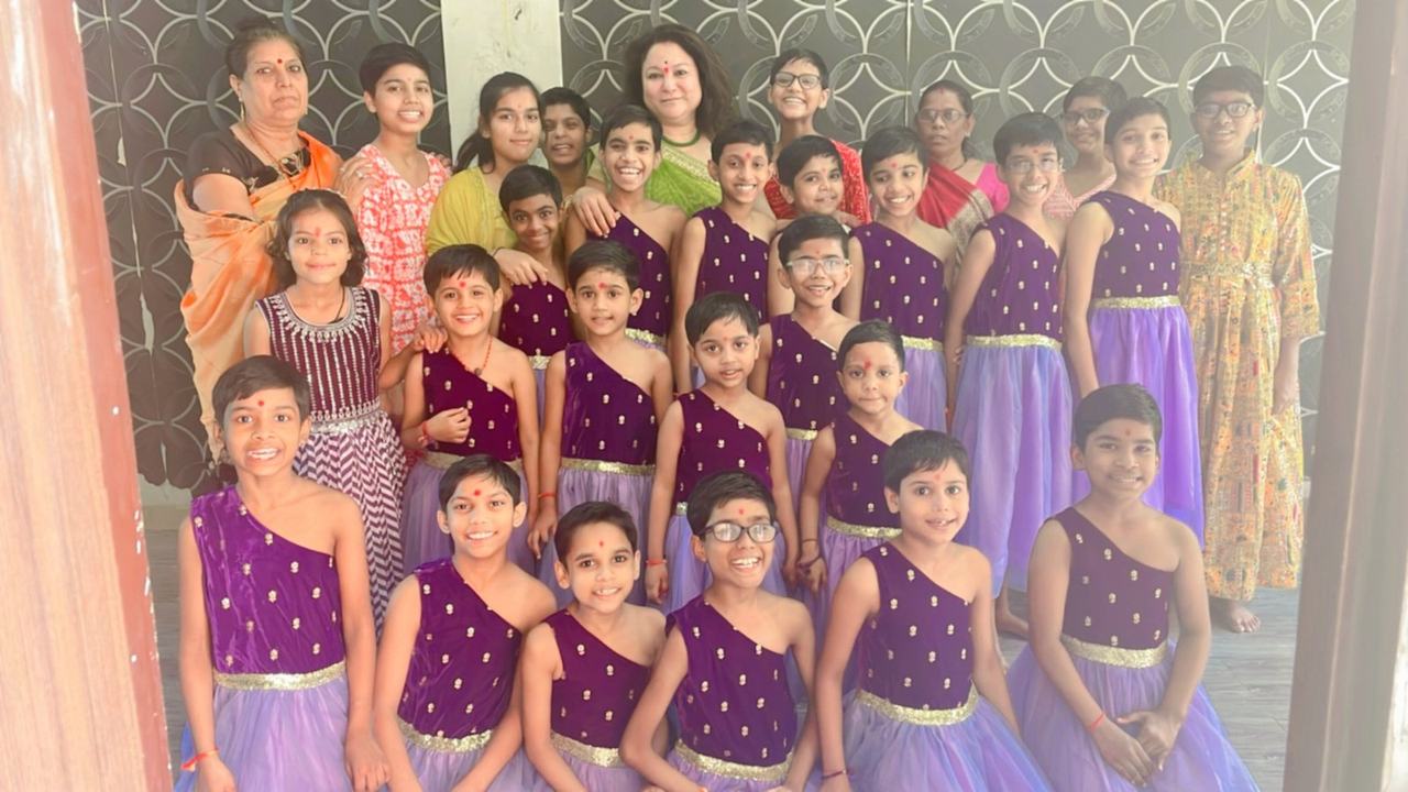 Group of girls in purple dance costumes