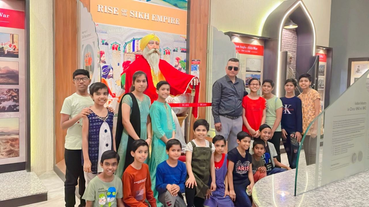 Children exploring a museum exhibit indoors