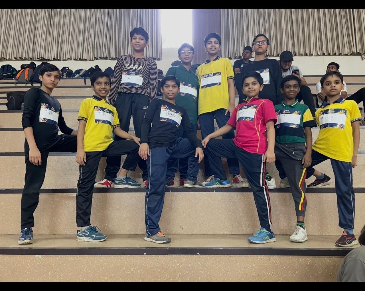 Boys wearing event bibs at a school sports day
