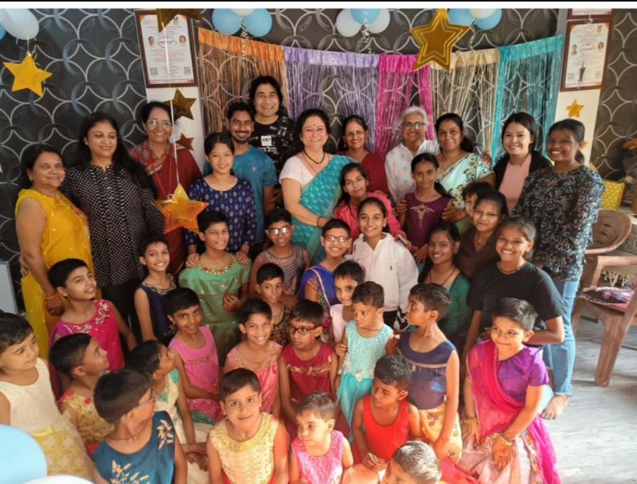 Girls and volunteers from Shiv Karmsthali celebrating together at a community gathering